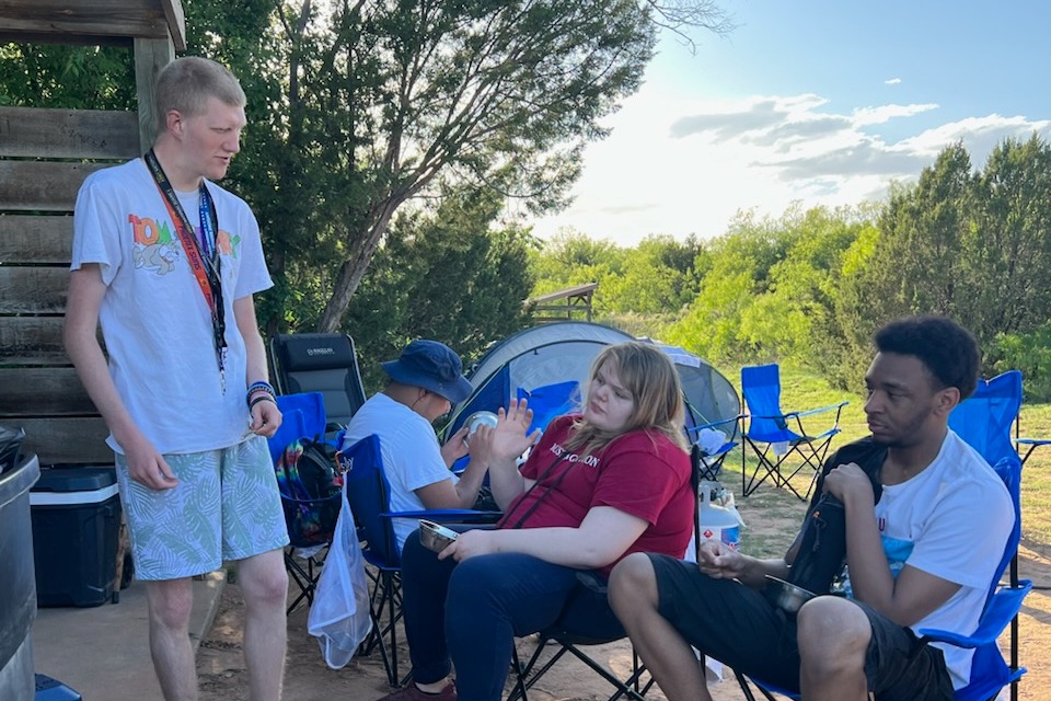 VTC campers telling stories from their camp chairs