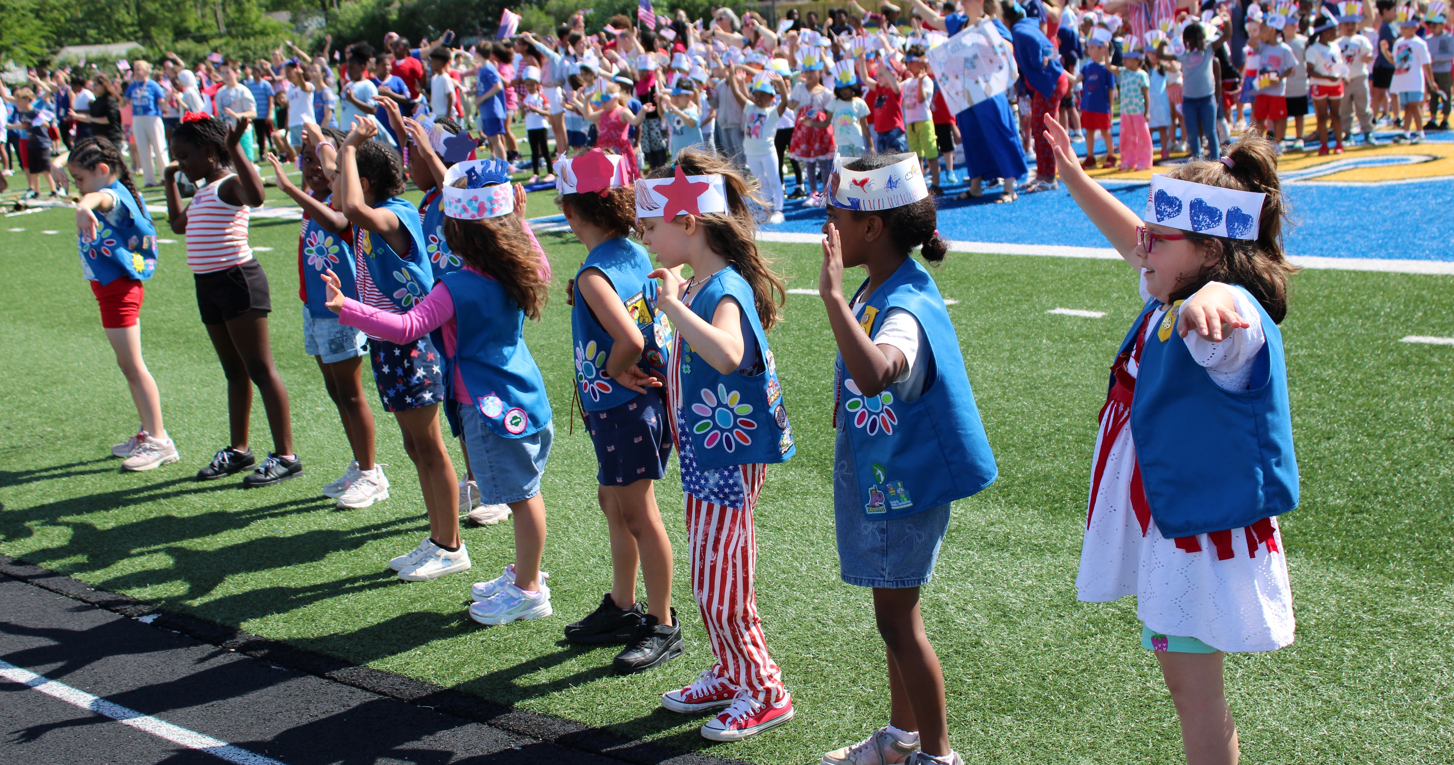 Nine Daisy Scouts at the Cleveland Hill Elementary Flag Day Parade and celebration