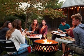 group of friends around a fire