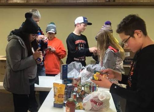 People gathering pantry items