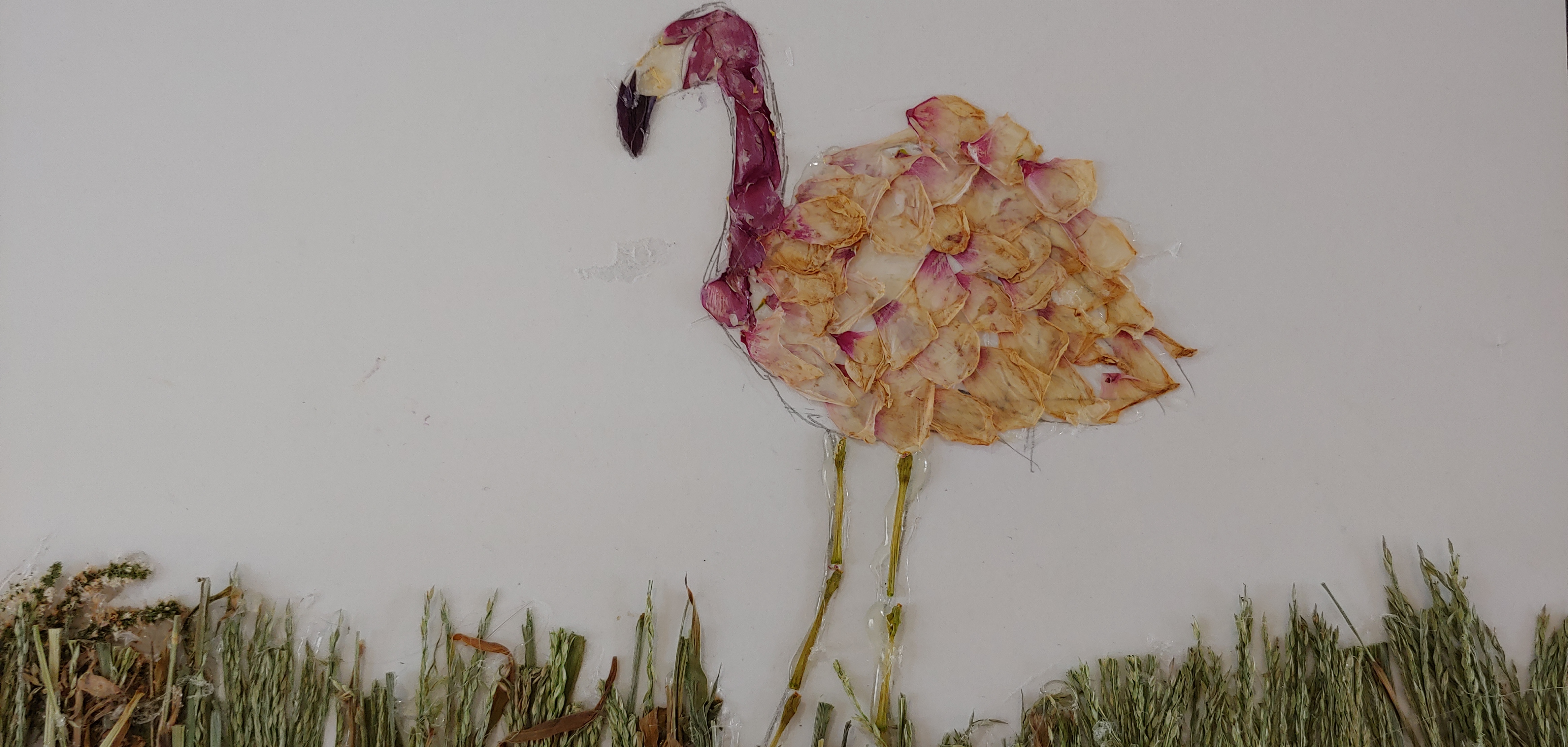 flamingo made of leaves, grass, and flowers