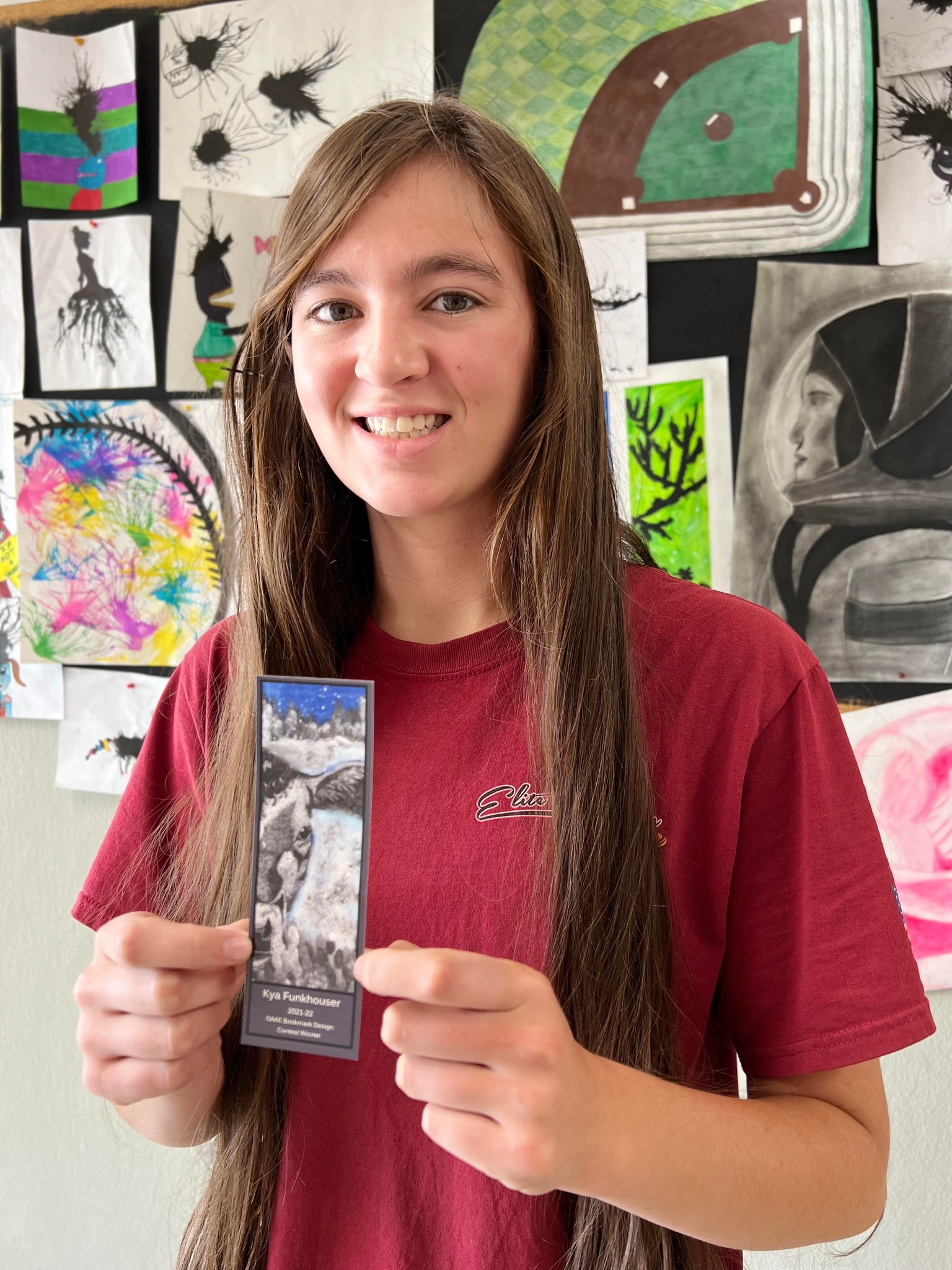 Student holds award-winning bookmark