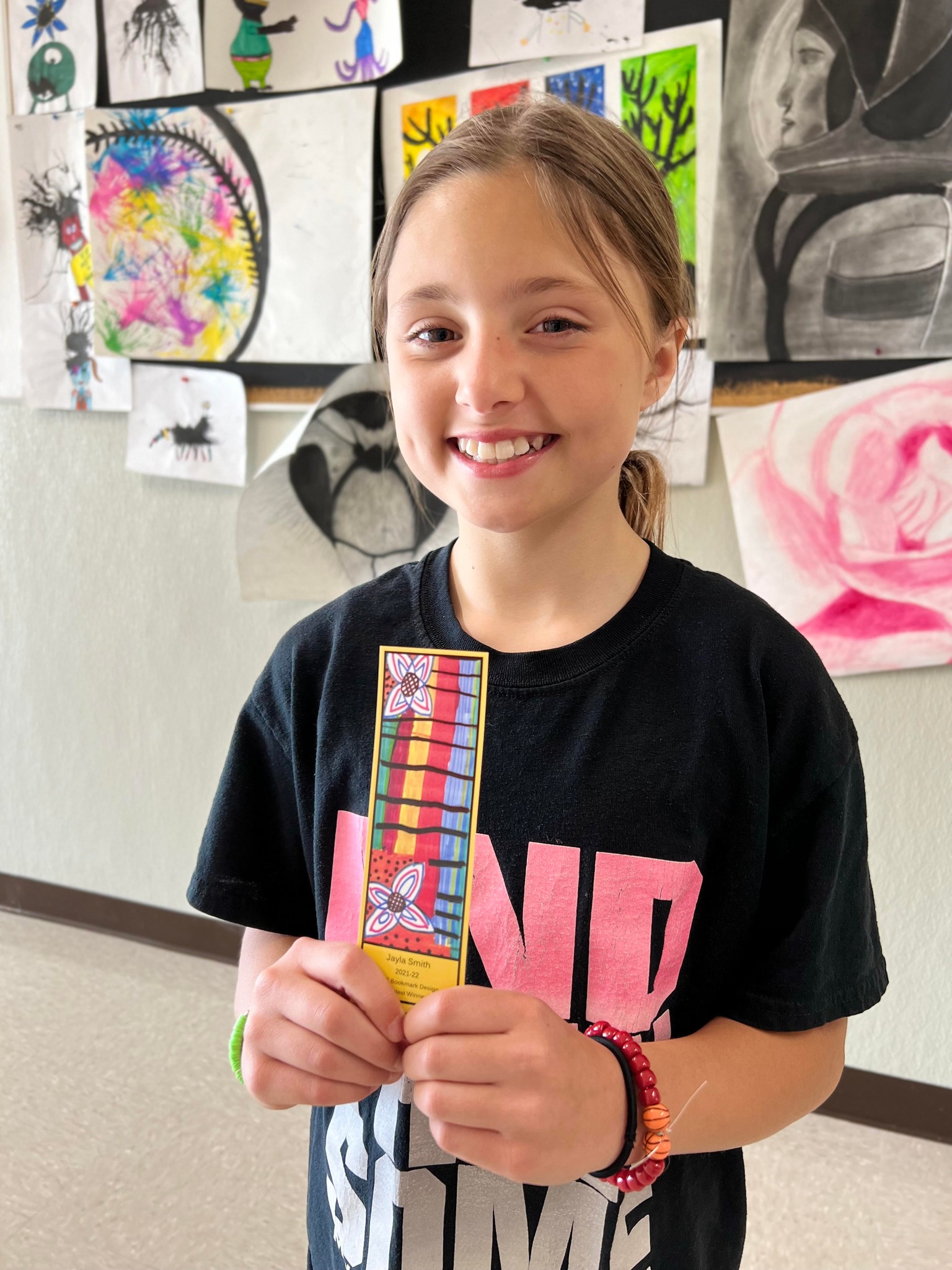 Student holds award-winning bookmark