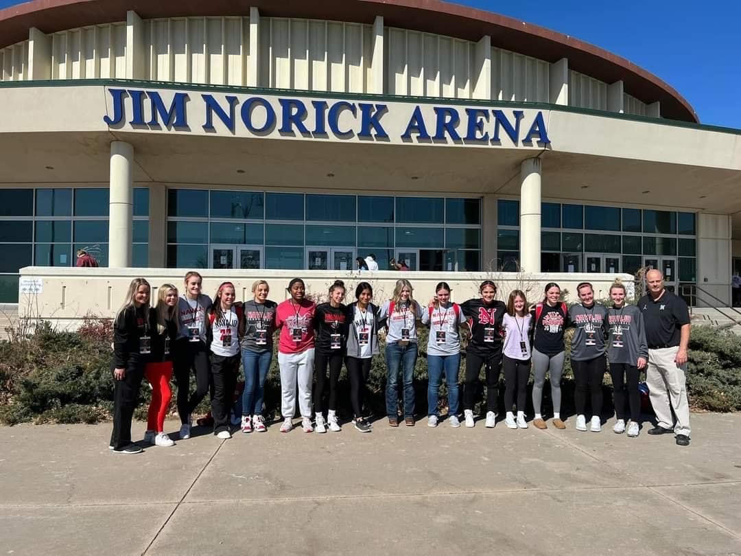 Girls pose outside arena during 2022 State Basketball Tournament
