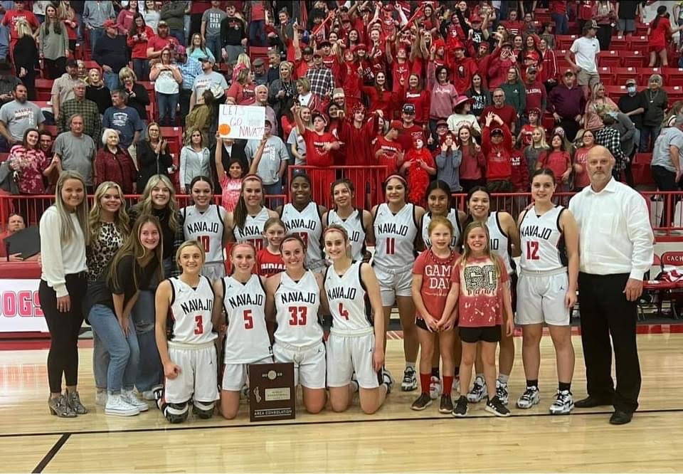 Girls pose with championship trophy