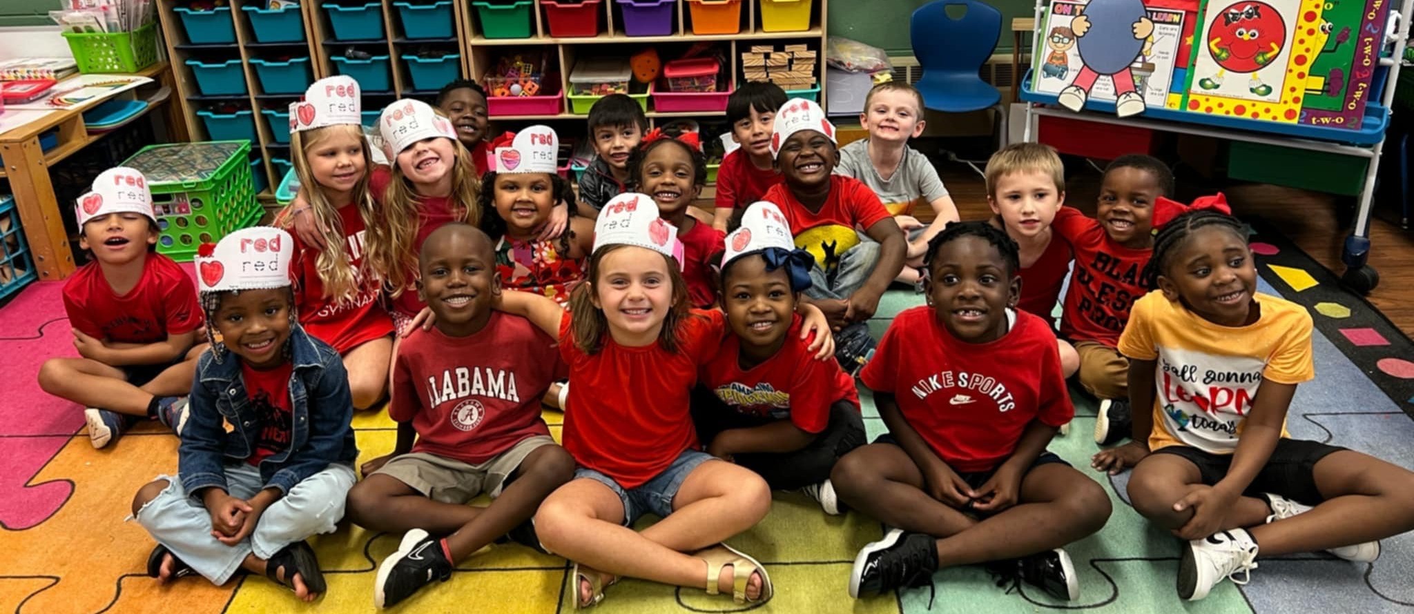 Class of students wearing red