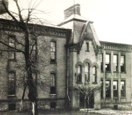 black and white photo of brick school building