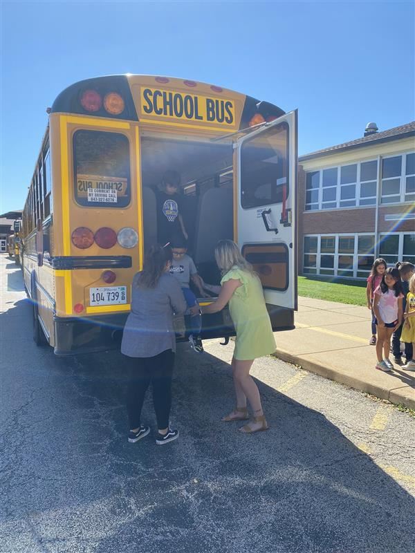 Teachers practicing Bus evacuation drills 