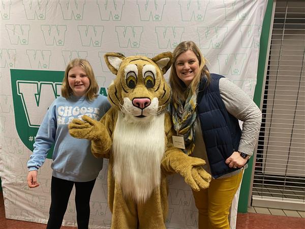 Mascot with student and parents