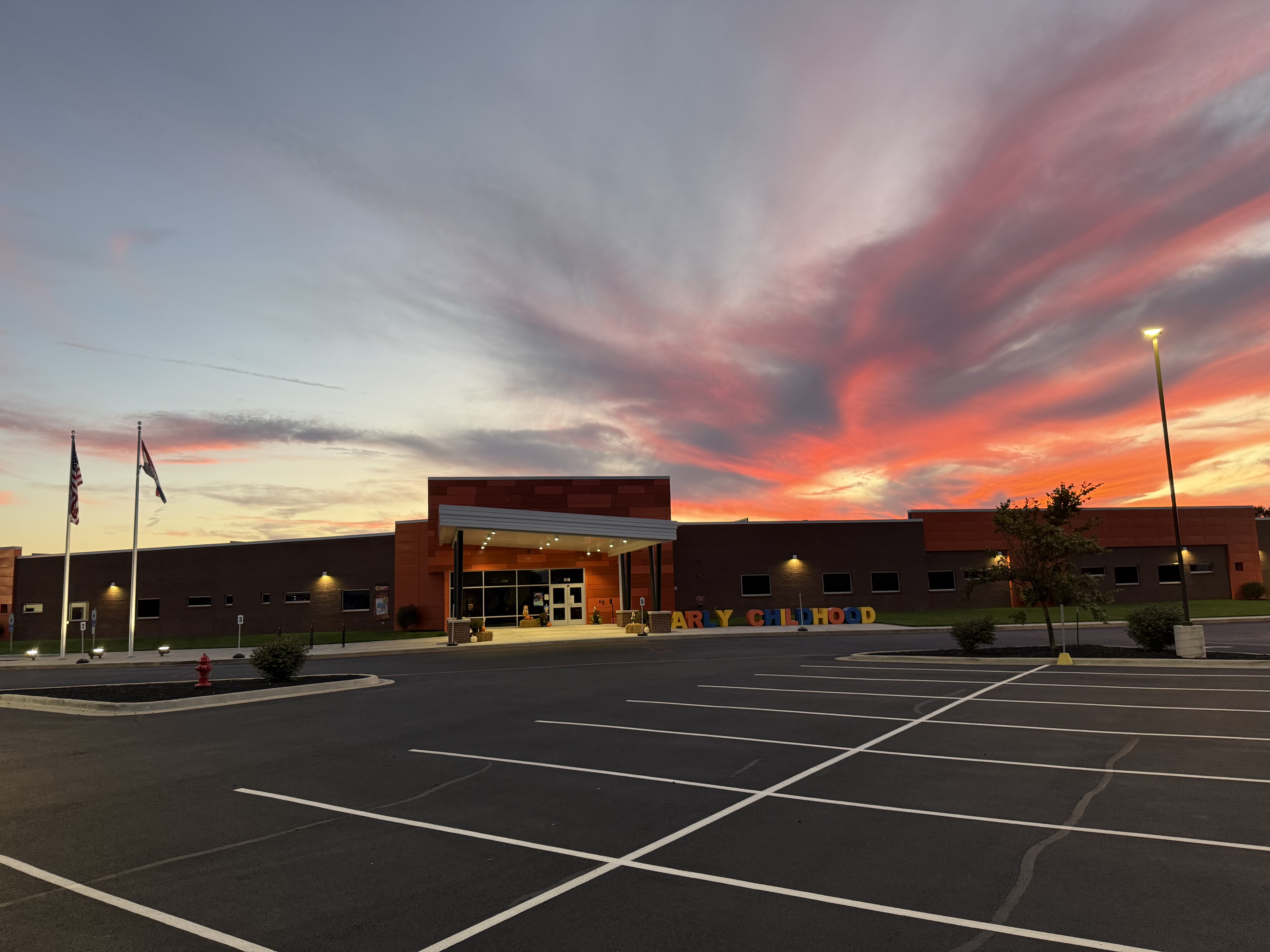 Early Childhood Building with pink sunset in the background.