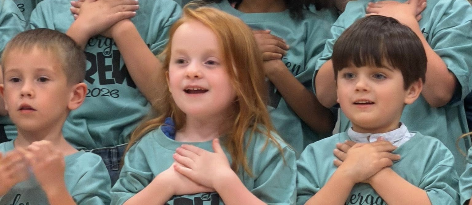 Schofield students singing at a music performance.