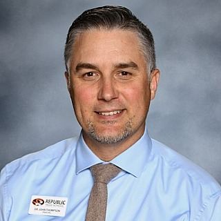Mr. John Thompson