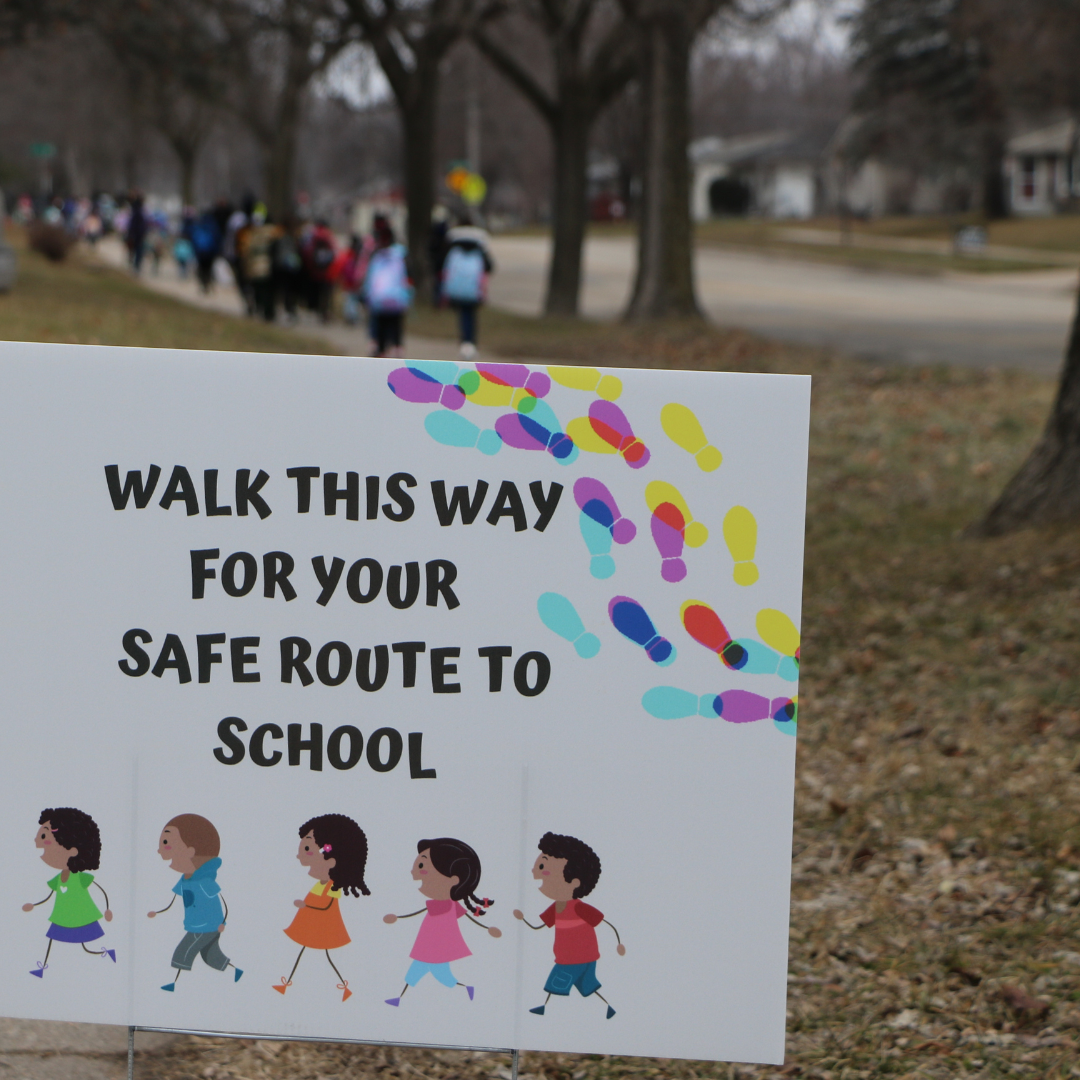 Signing saying "Walk this way for your safe route to school"