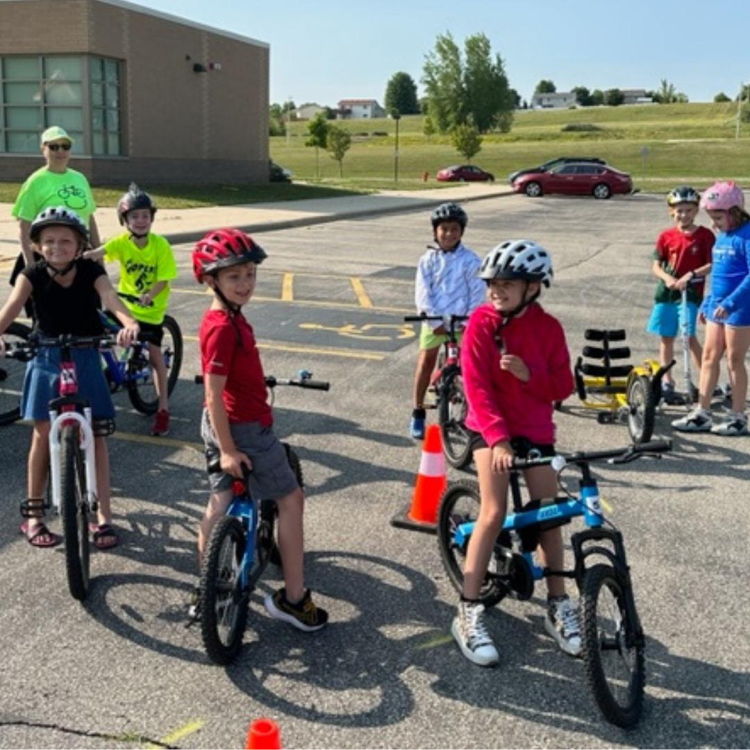 Students on Bikes and School at Gibbs Elementary School