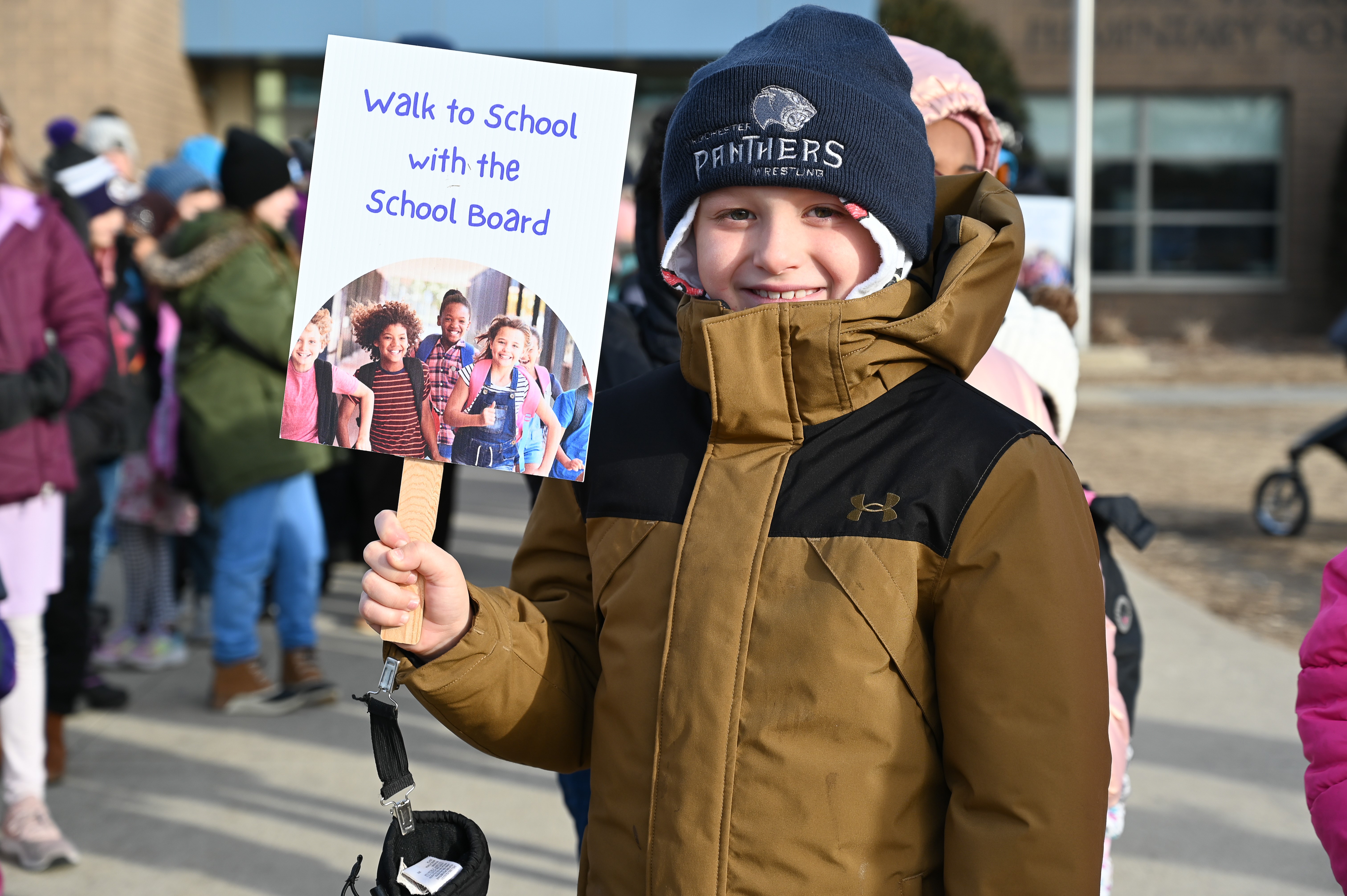 Student with school board logo