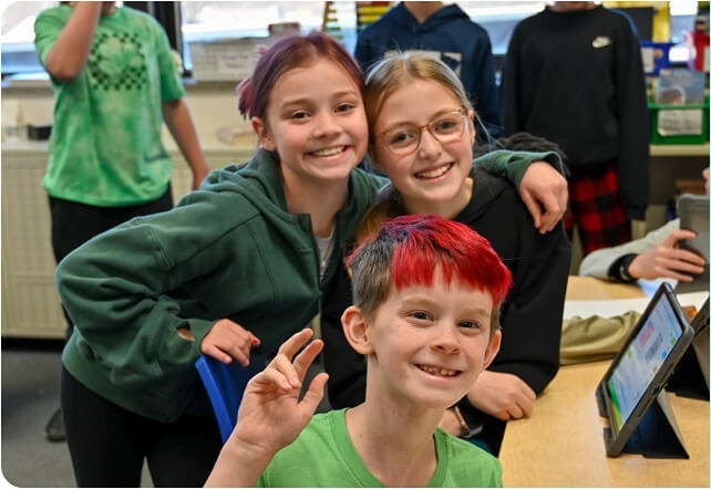 students smiling and posing