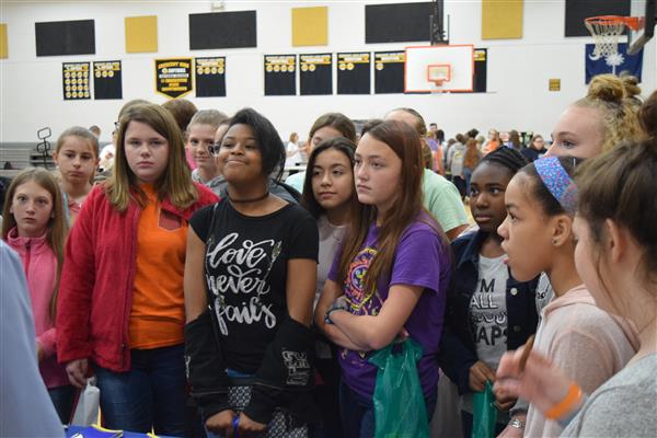 A group of students paying attention to their teahcer.