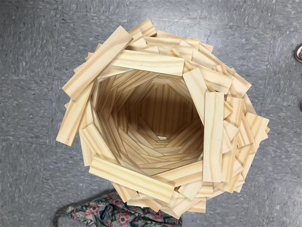 An inside of a wooden-made tower by the students