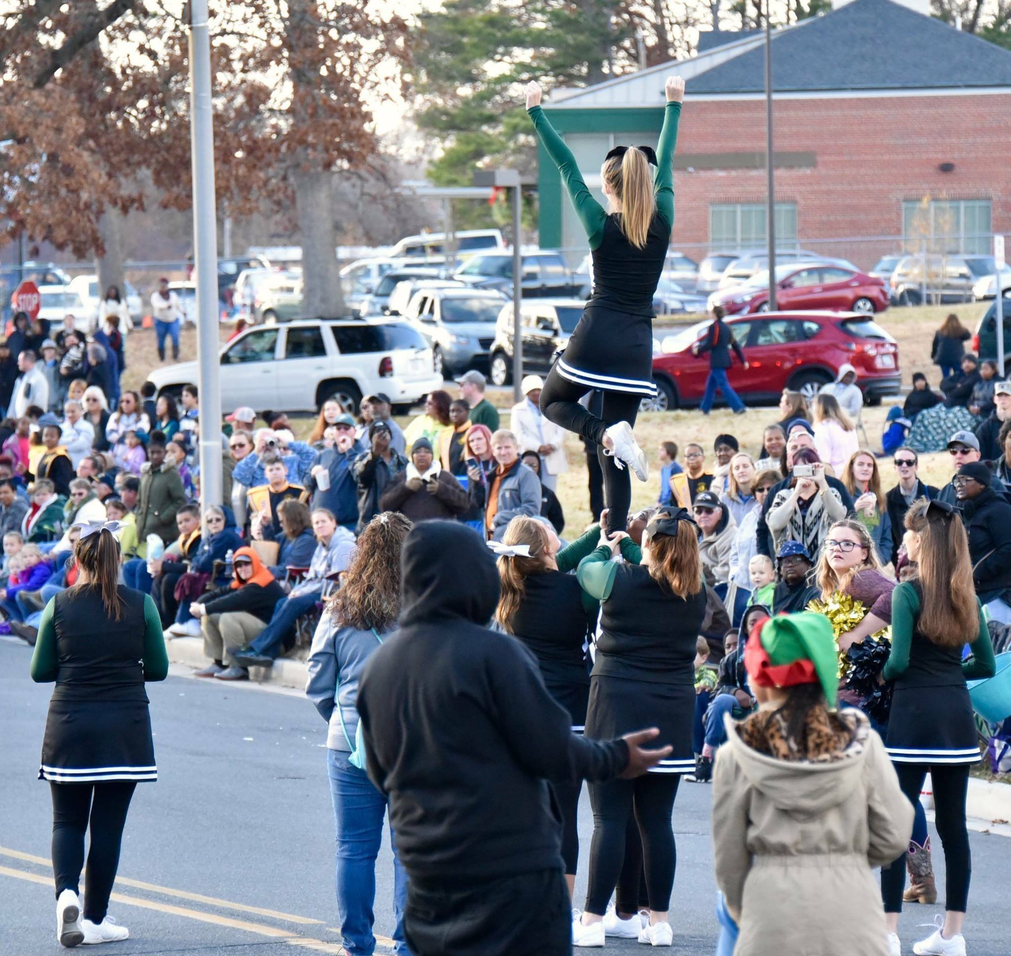 Mardela High cheerleaders walking in the Salisbury Christmas Parade 