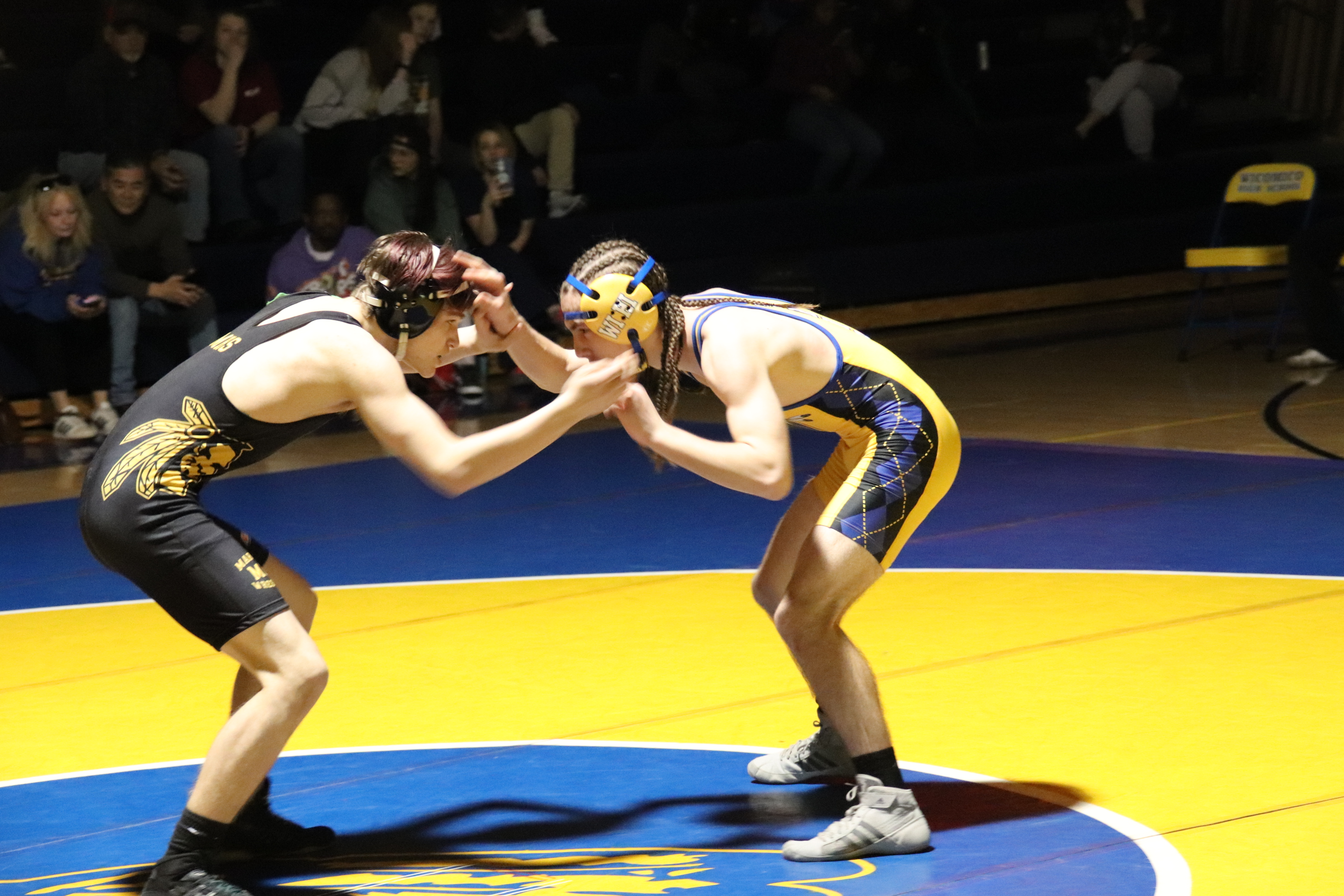 wrestlers square off to begin their match