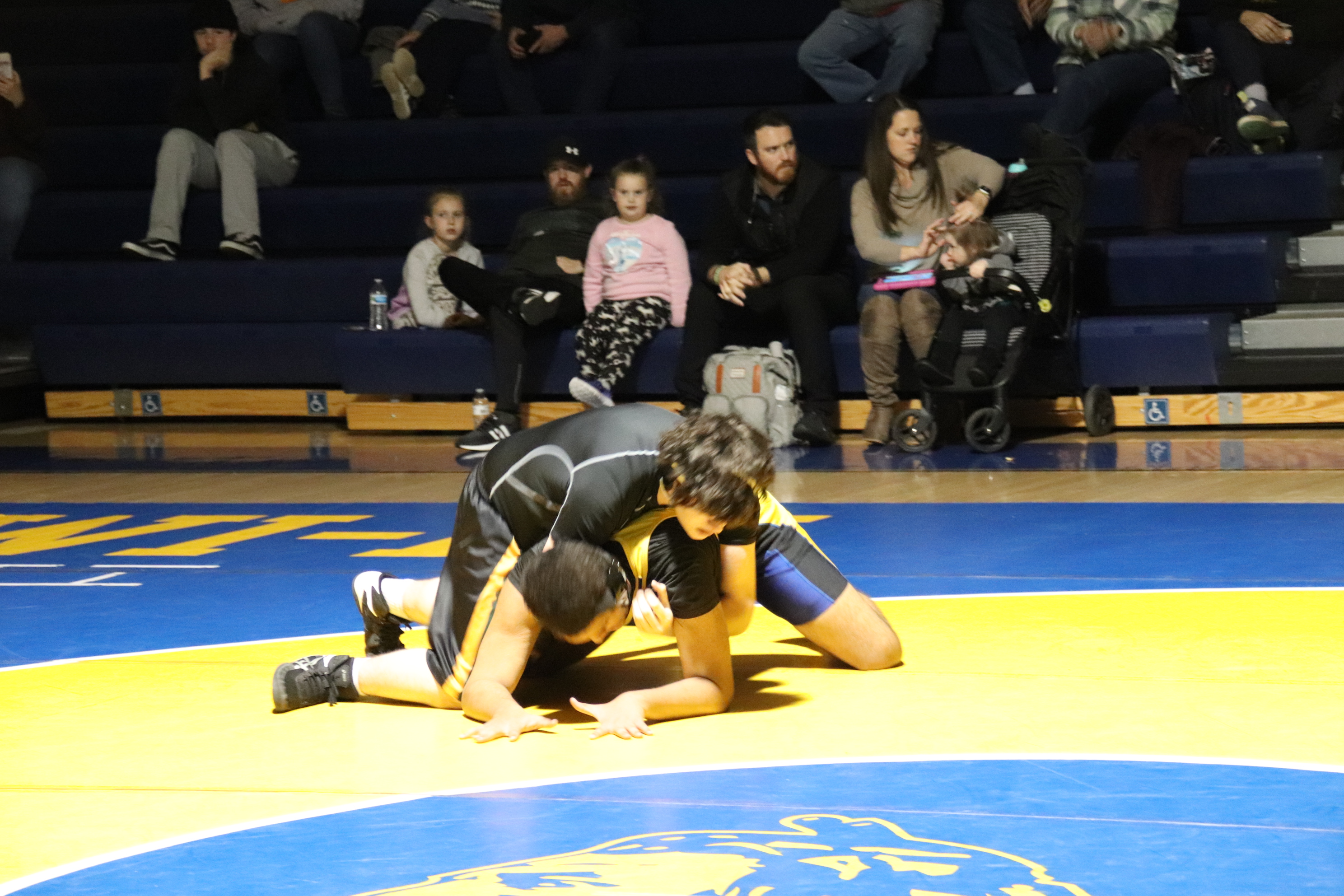 wrestler trying to take down his opponent