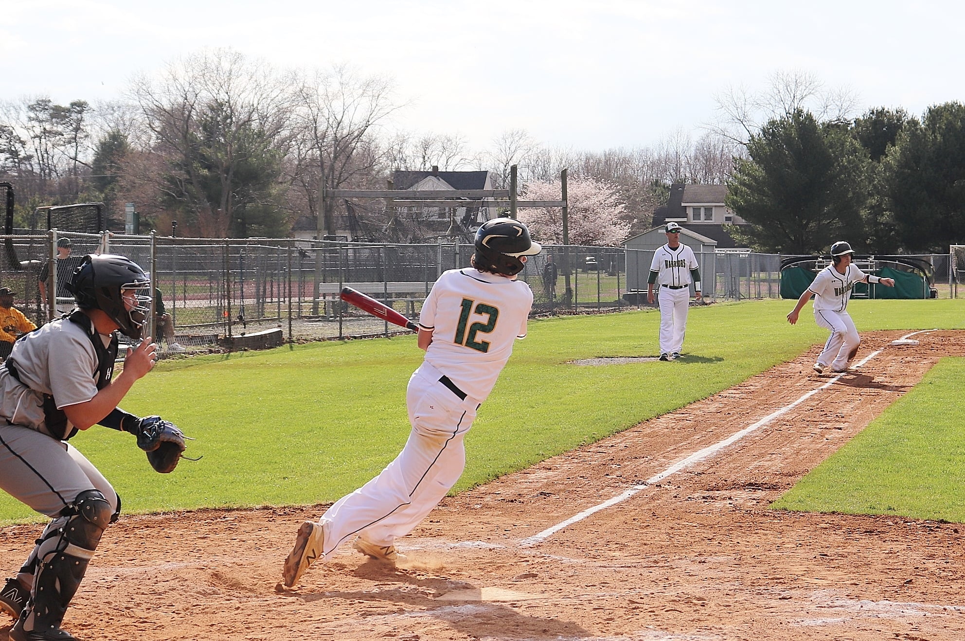 baseball plays swings for a base hit