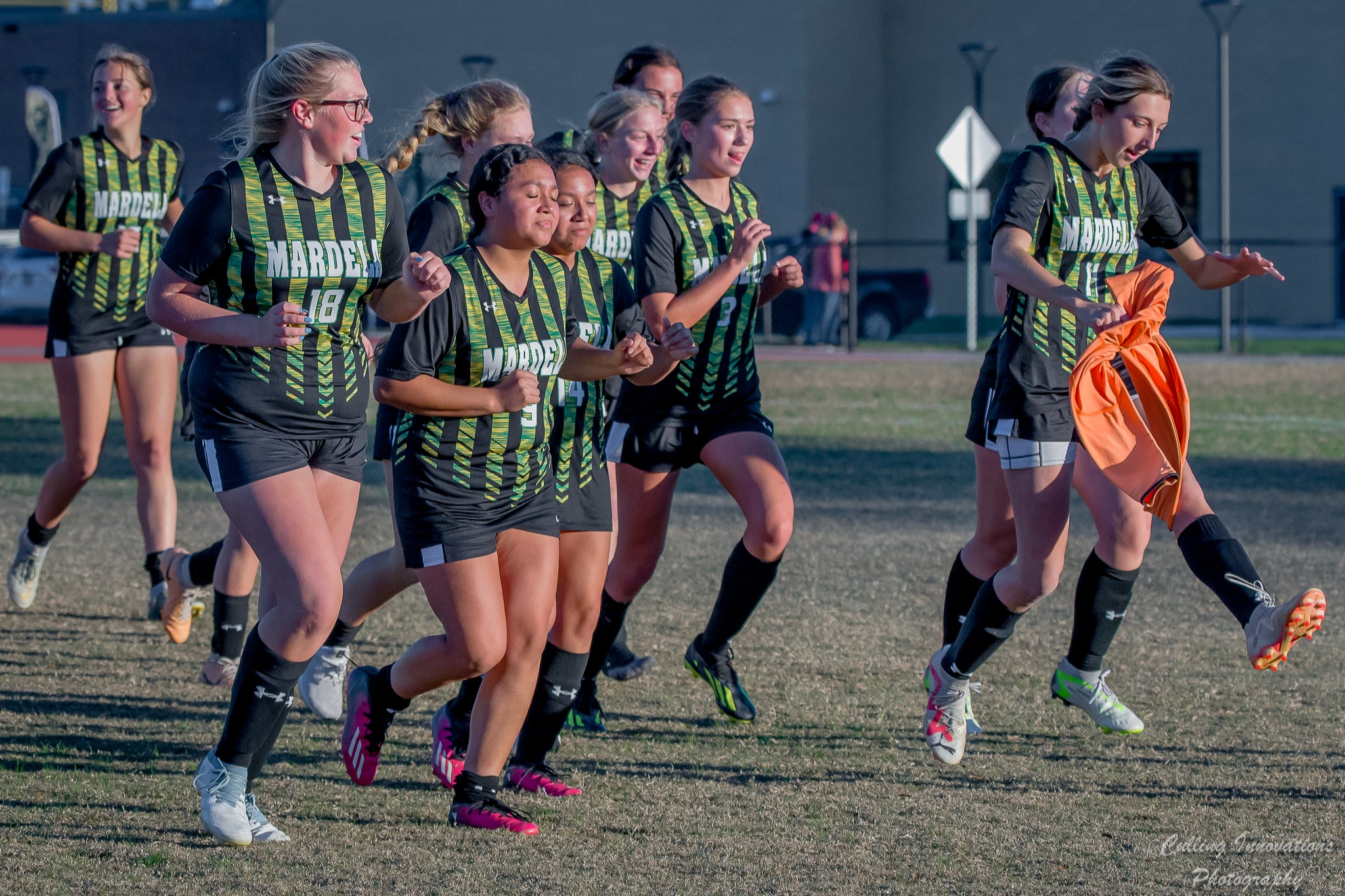 Image of Mardela High girls soccer running down the field