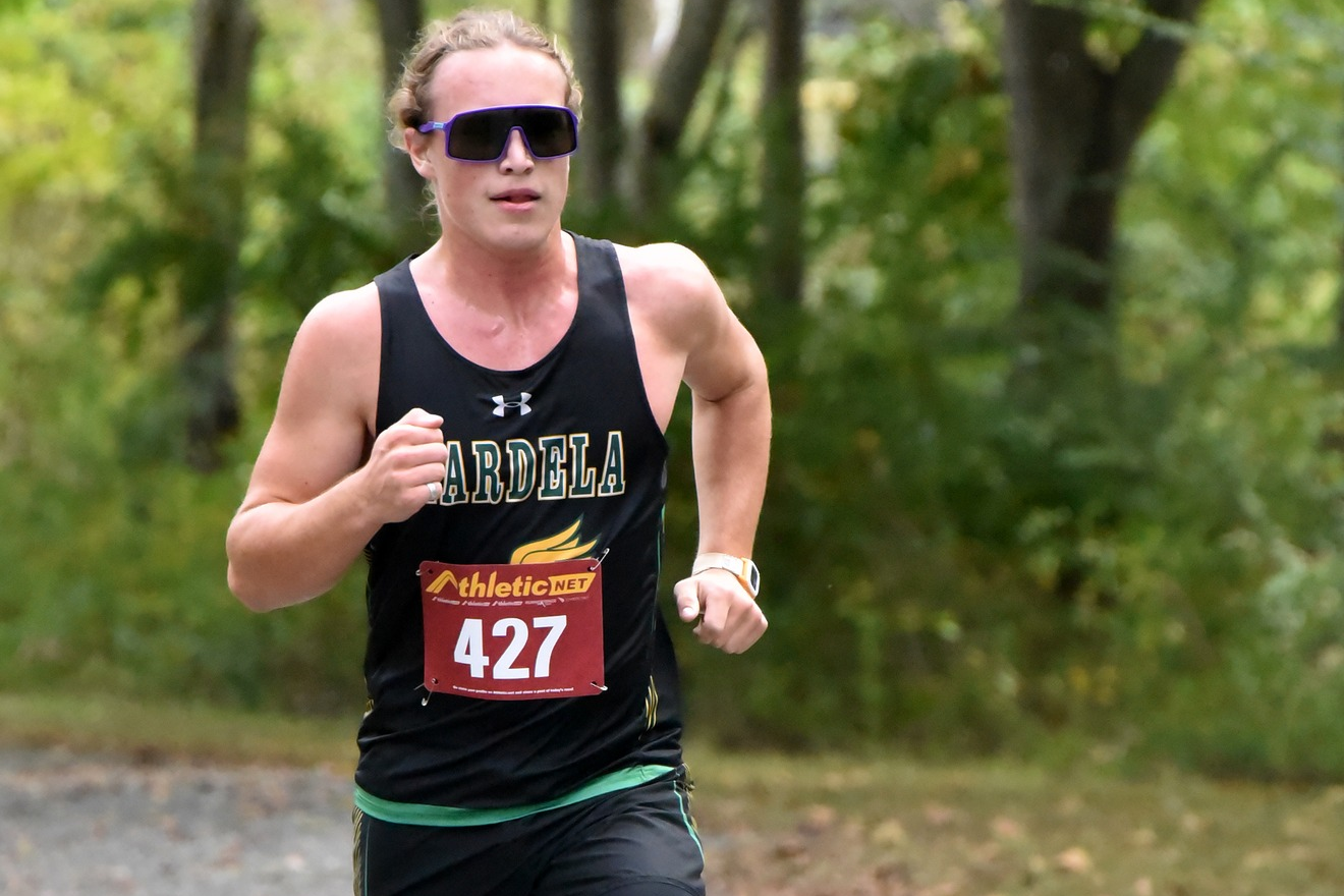 Image of Mardela High boys cross country runner racing to the finish line