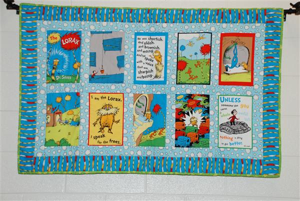 A board with book covers recommending them to the students.