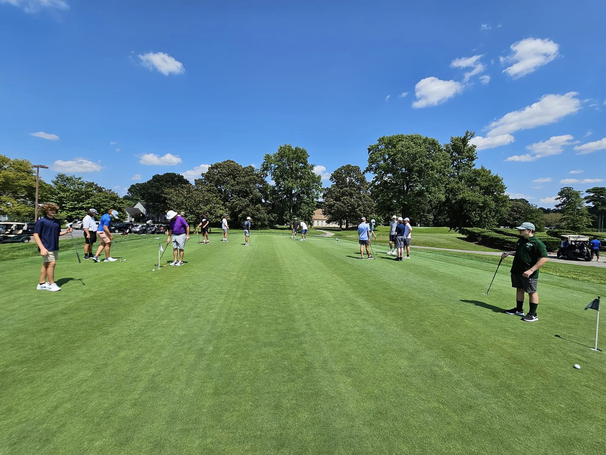 team practice on the putting green