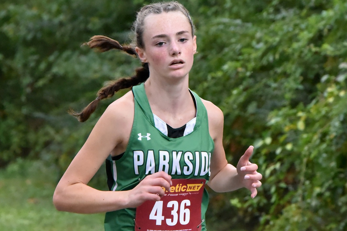 Image of Parkside High girl leading the pack in a cross country race