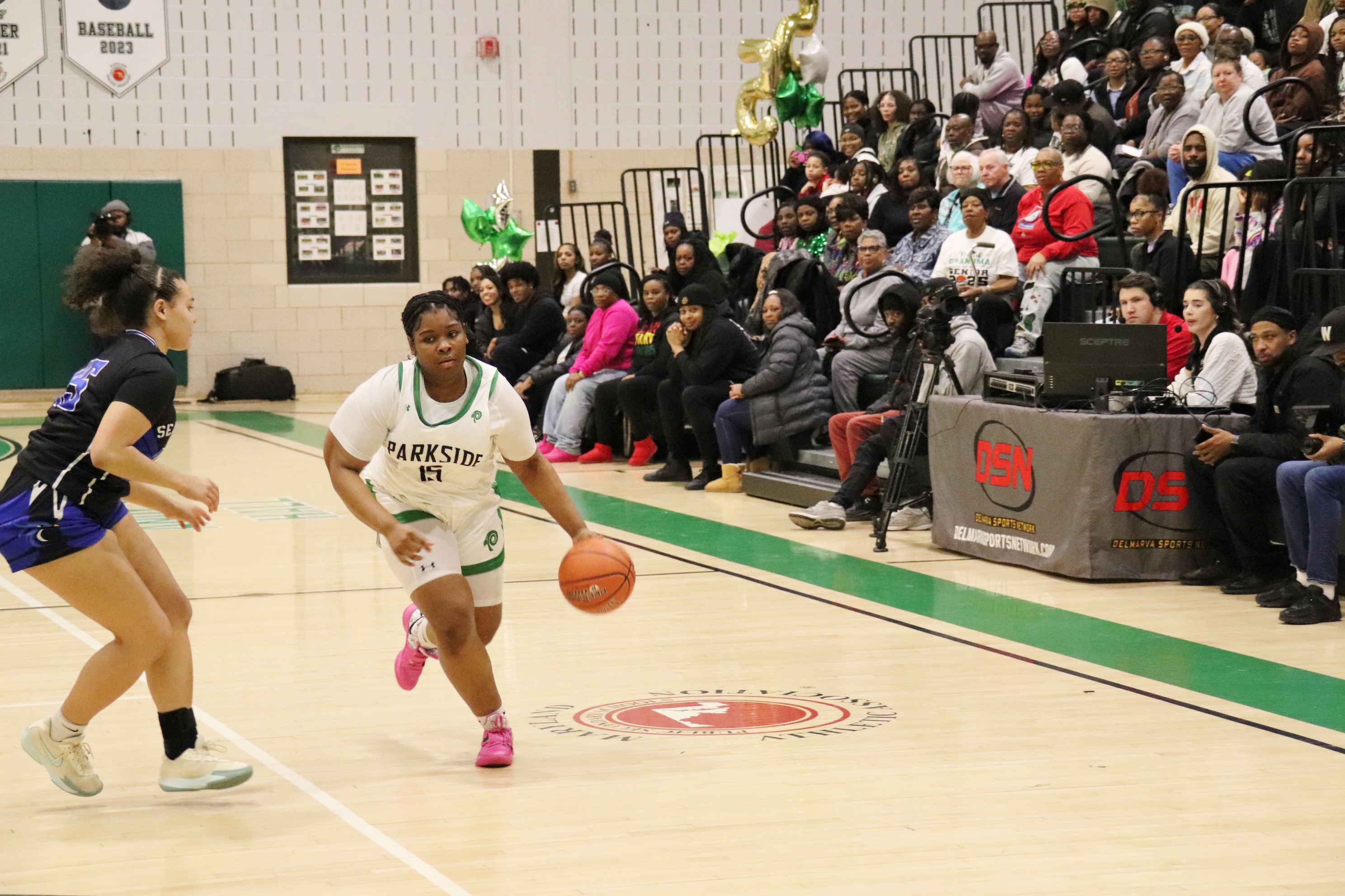 Image of Parkside girls basketball player driving to the basket