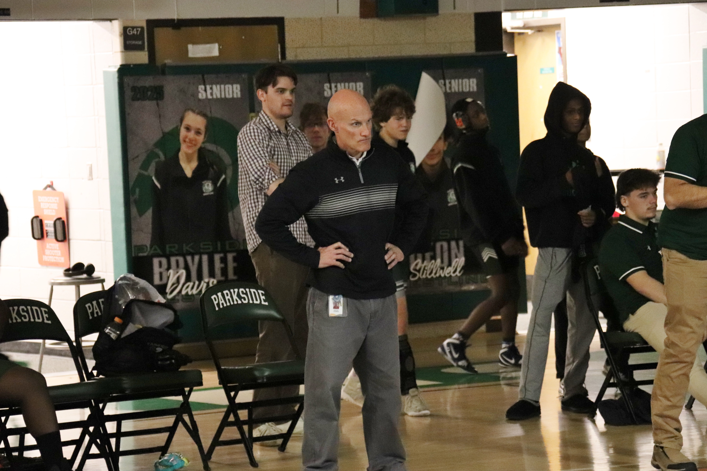 Image of Rams wrestling coach watching a match