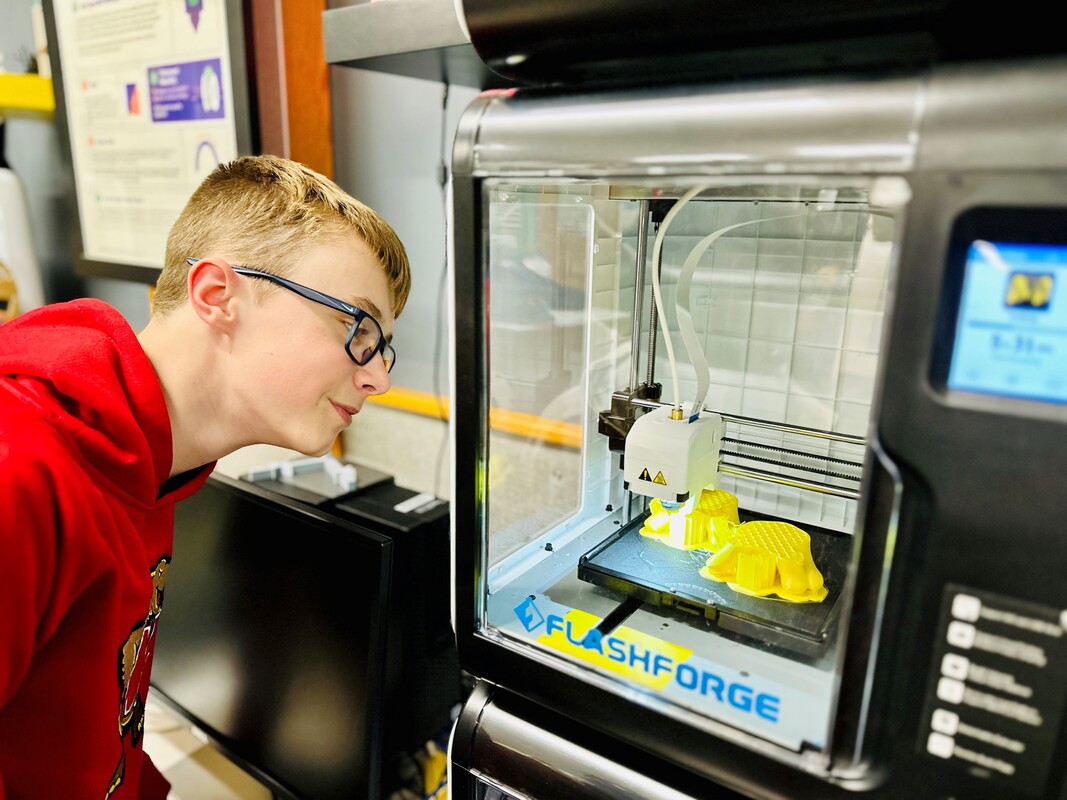 Image of student observing 3D Printing