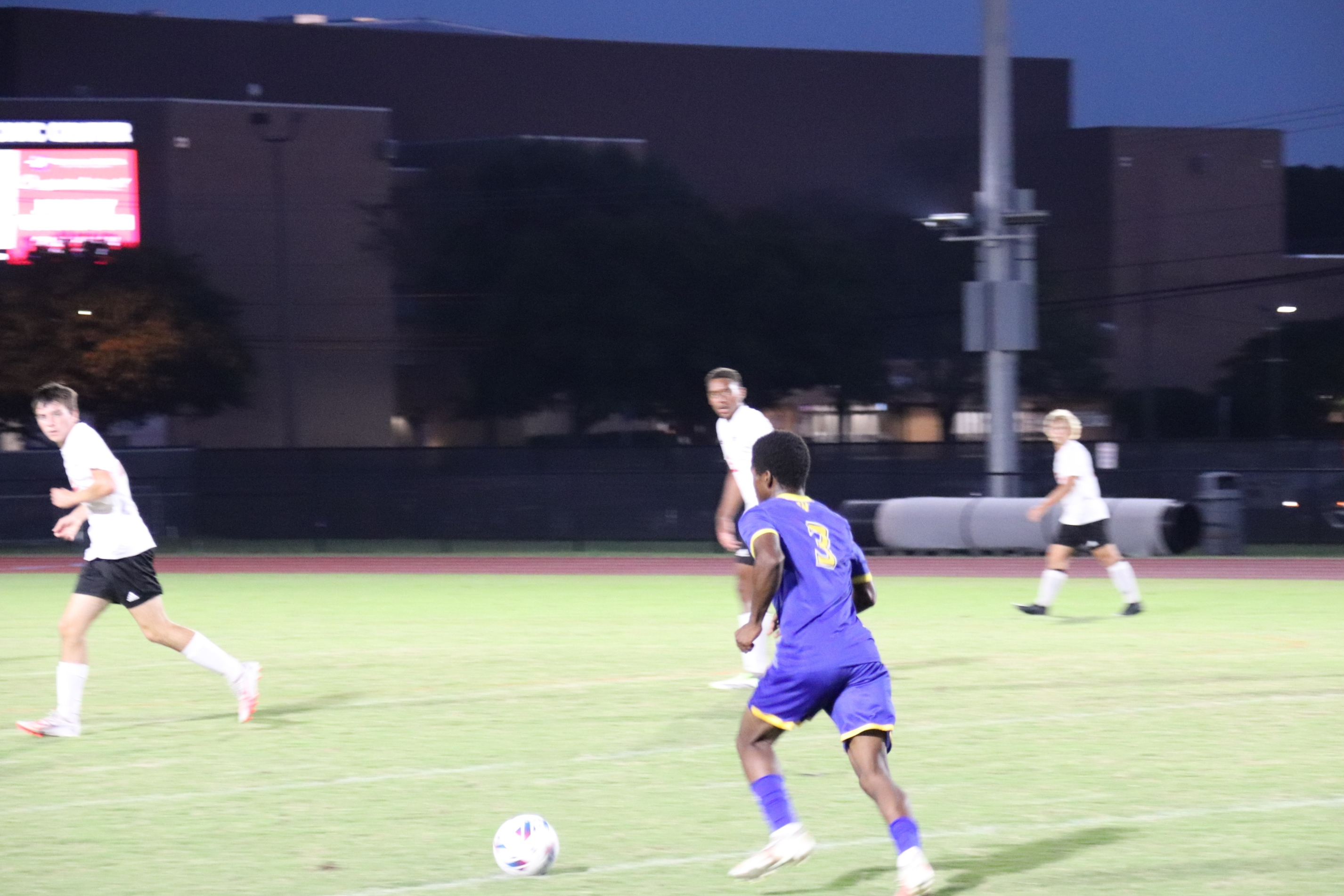 icomico High boys soccer player dribbling the ball down fieldmatch