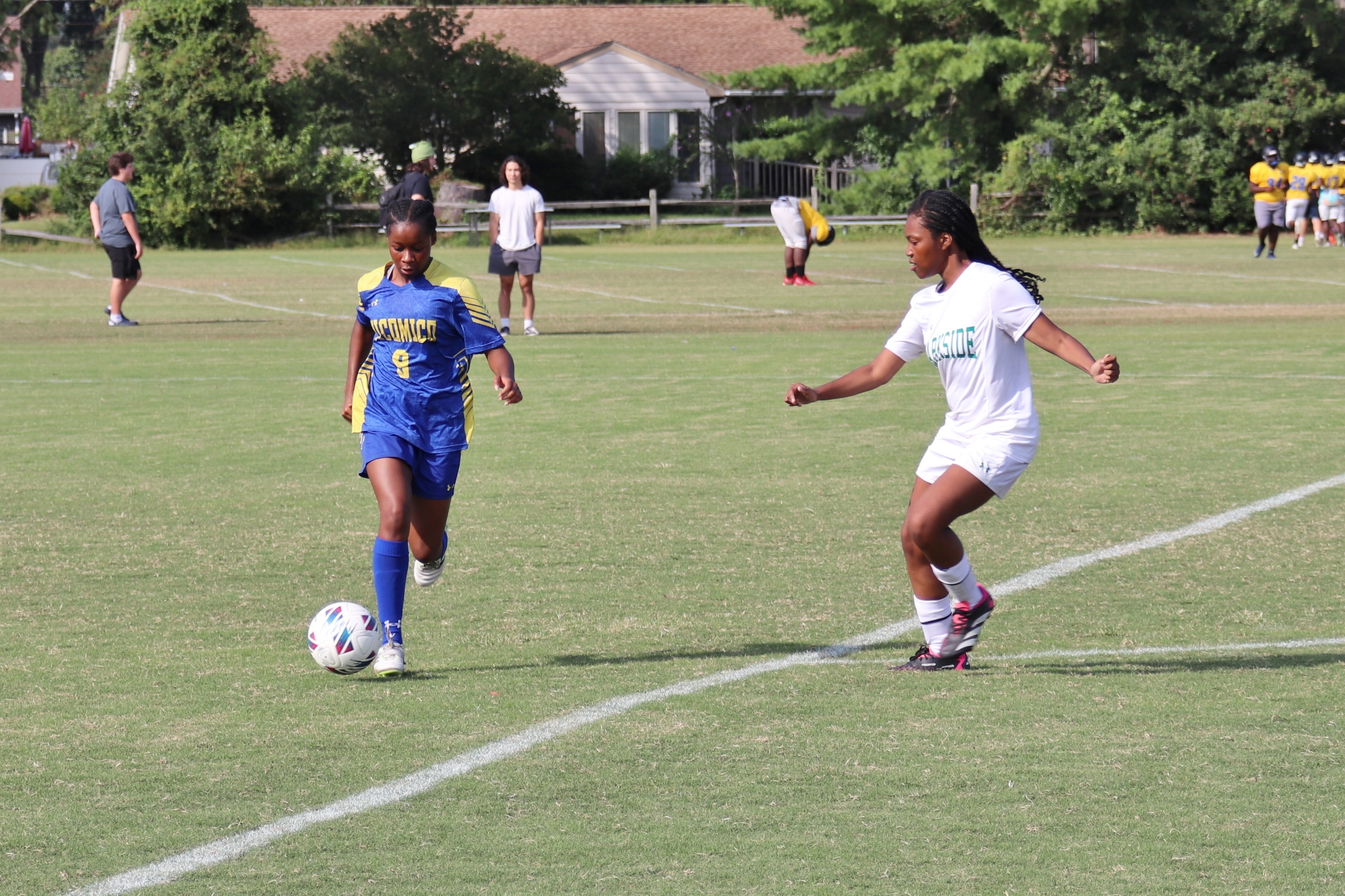 Image of girls soccer player dribbling the ball down the field