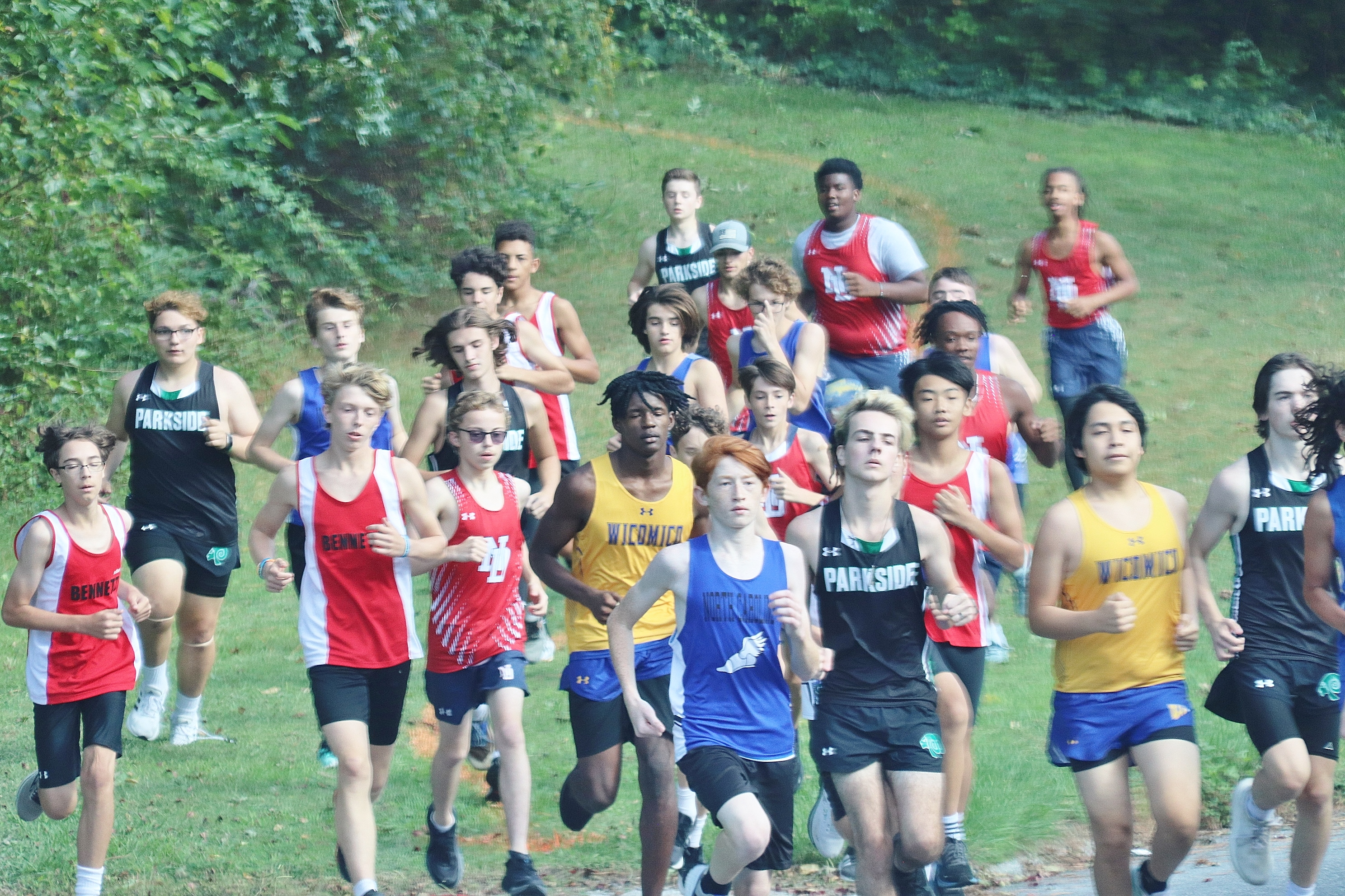 Wi-Hi boys cross country team participating in a meet