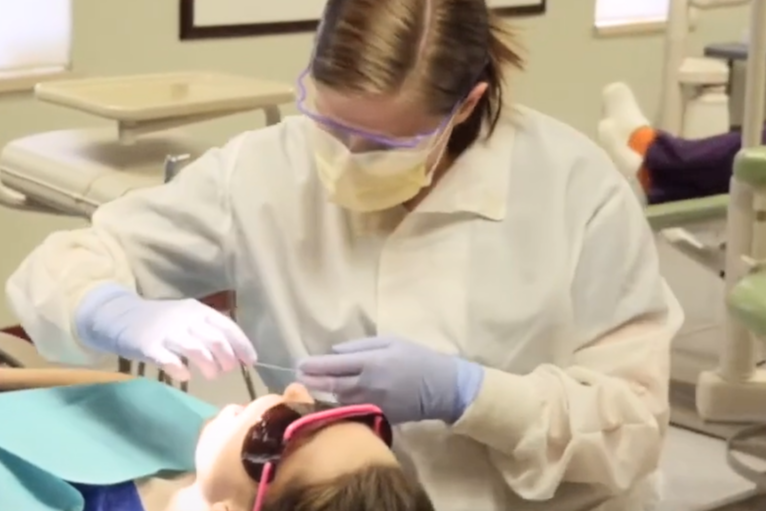 Student practicing dental care
