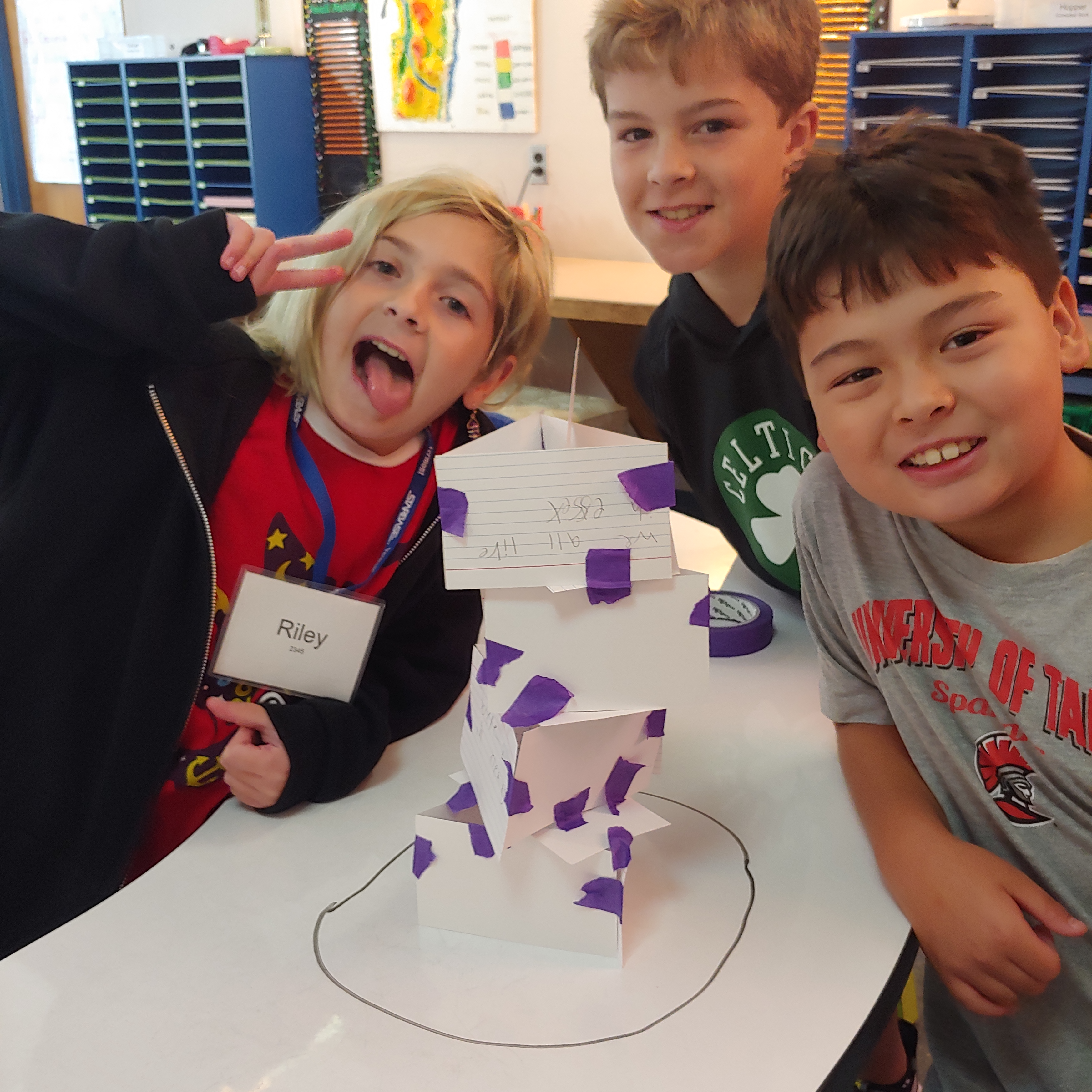 Building towers with index cards of things students have in common. 