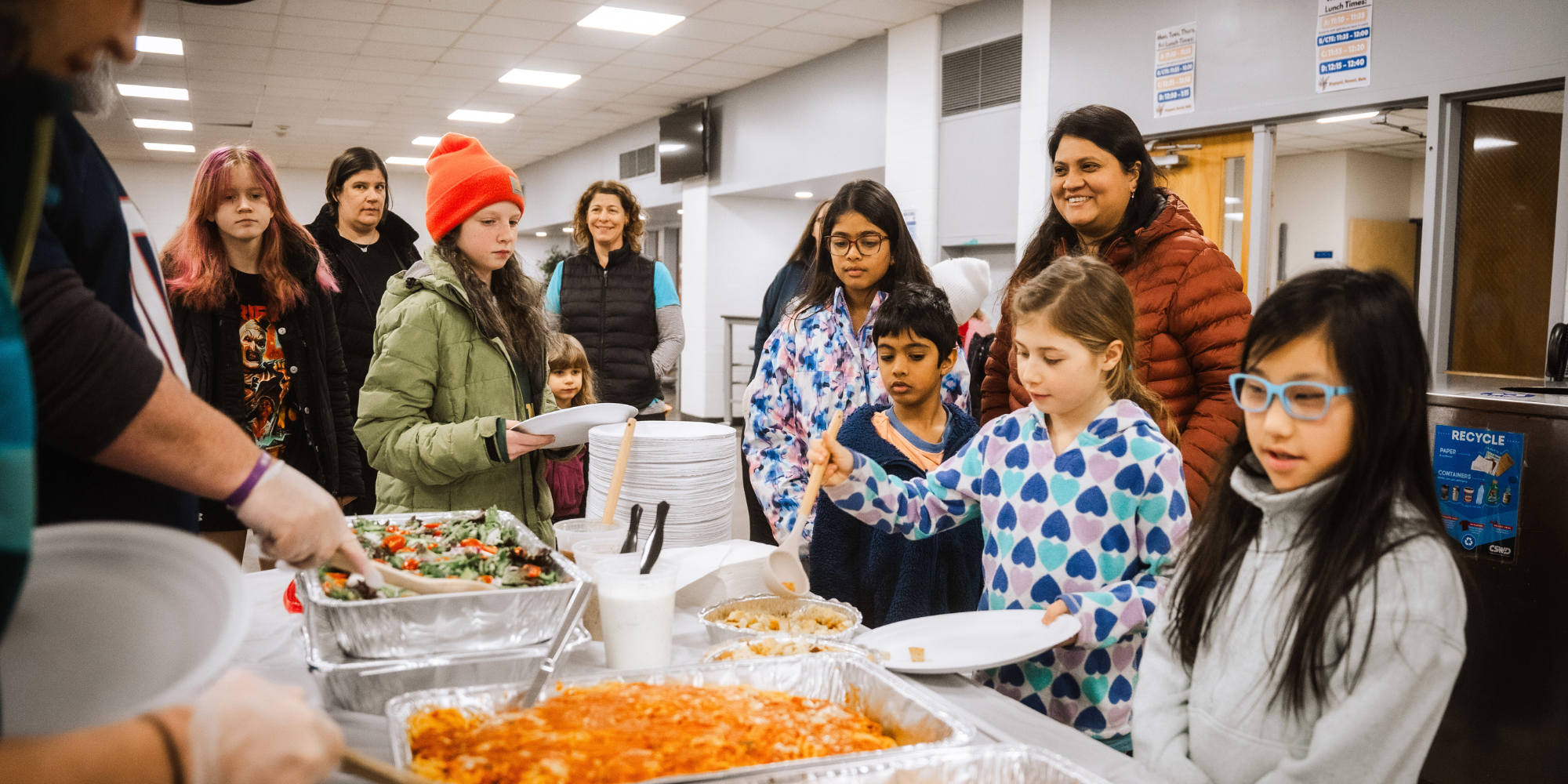 Students and families in line for dinner