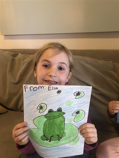 Student with a picture of a frog