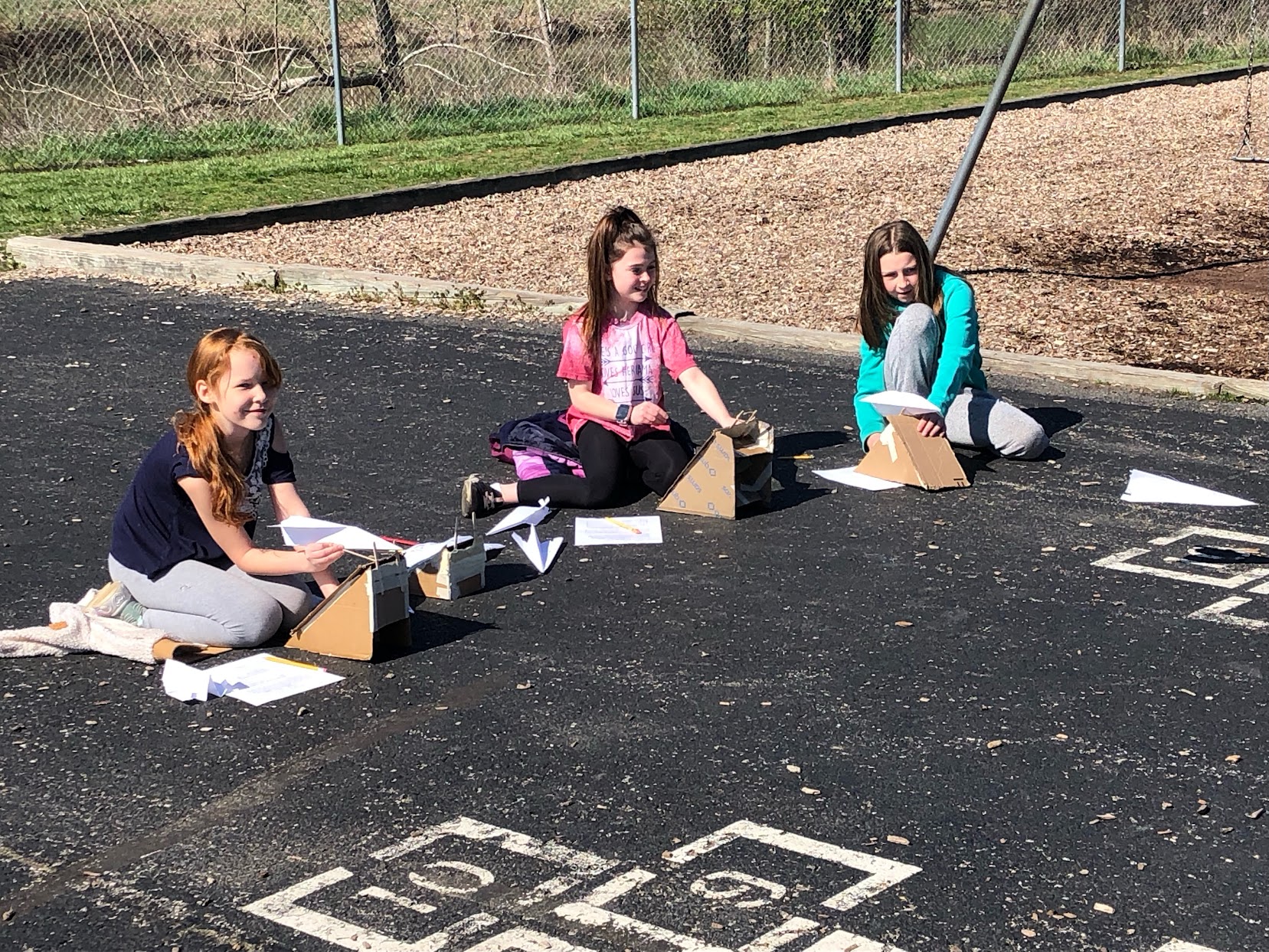 students prepare project outside 