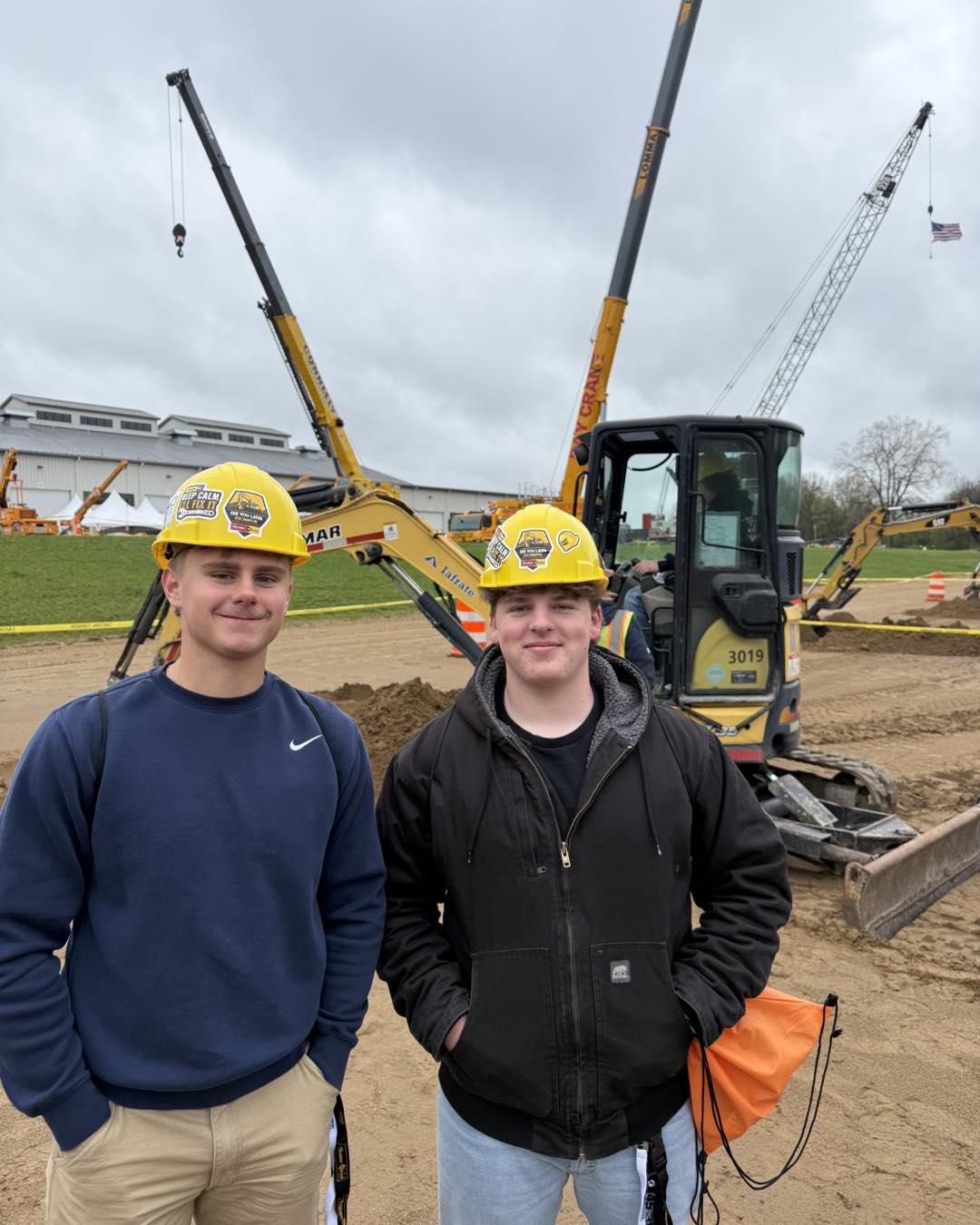 2 students on a construction site for a field trip