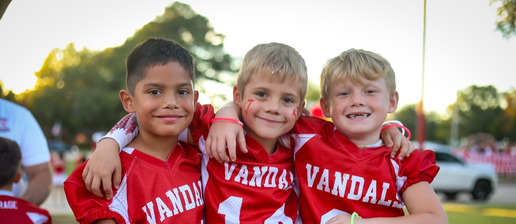 three students hugging