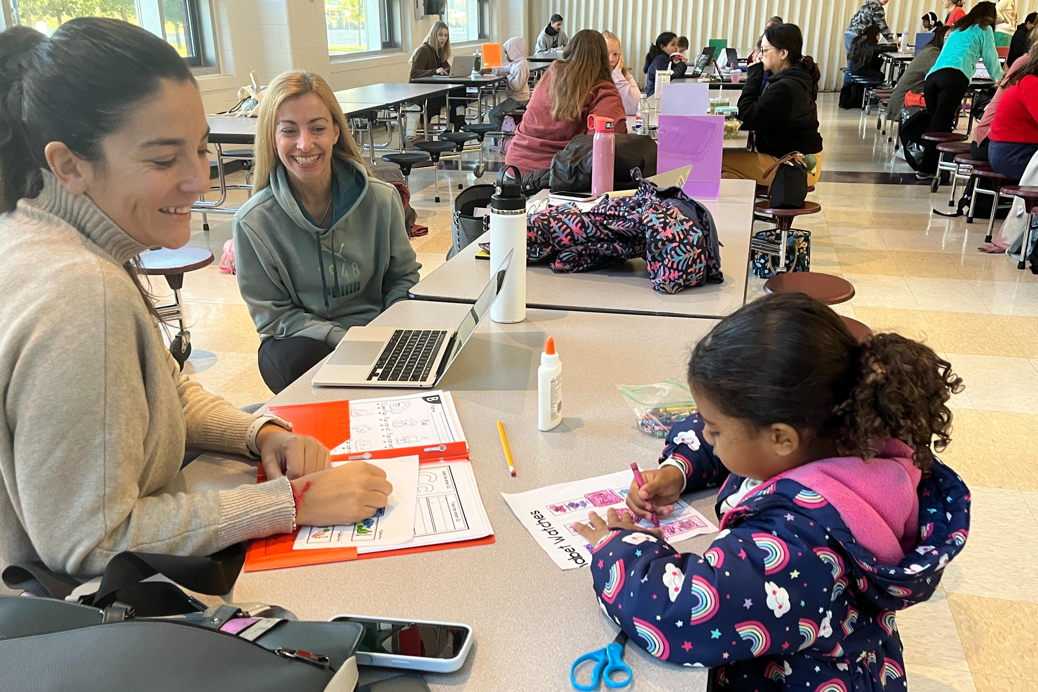 Student works with a teacher for one on one support