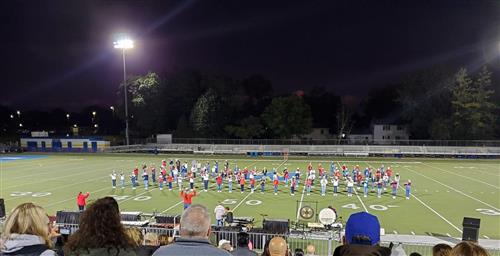 Photo of the band playing on the football field