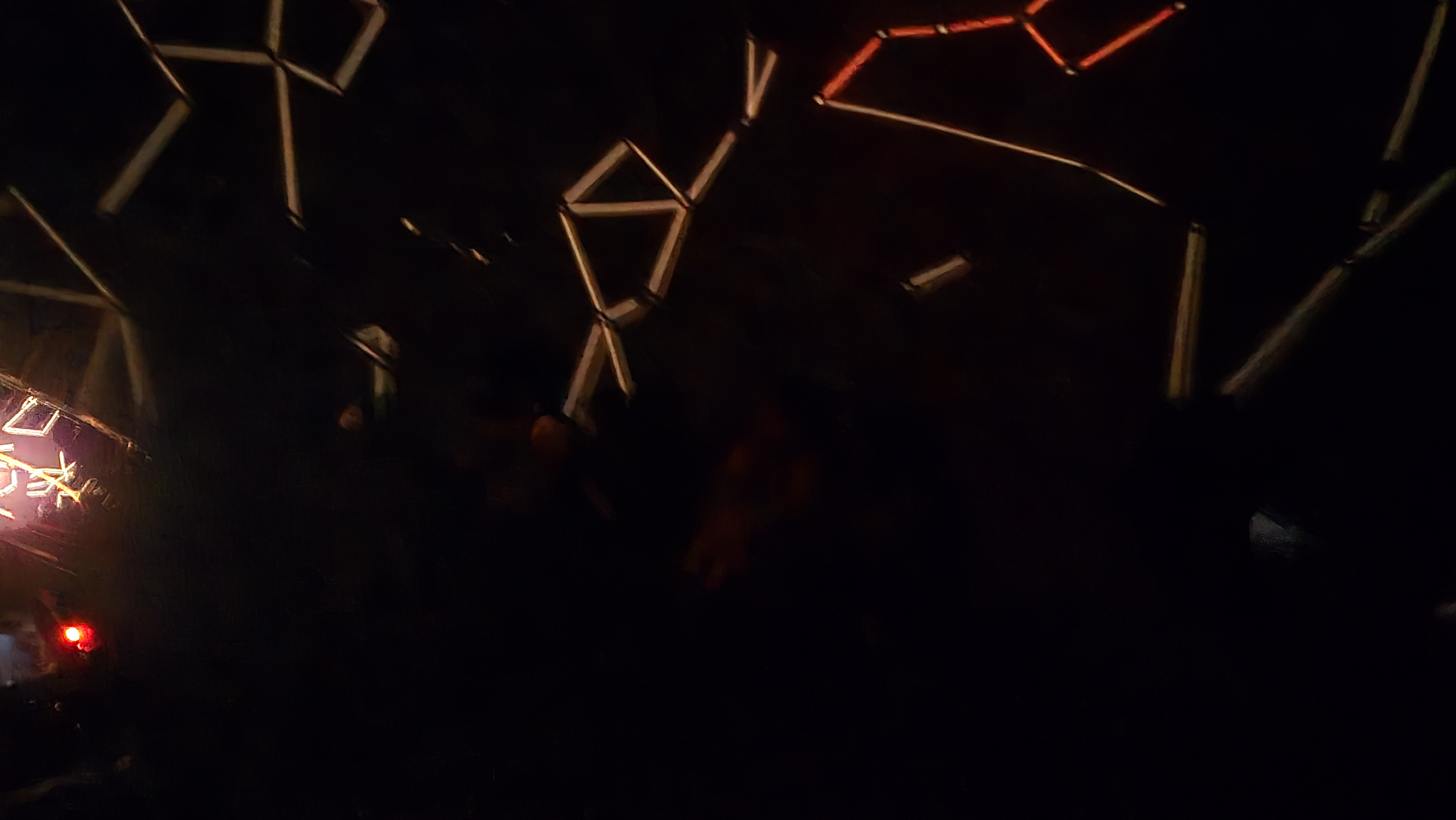 inside the star lab, constellations shown, faint outline of children's heads in the dark