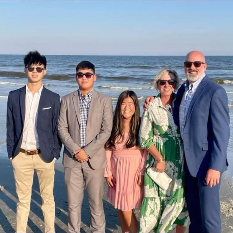 family of five at the beach (husband, wife, and 3 kids)