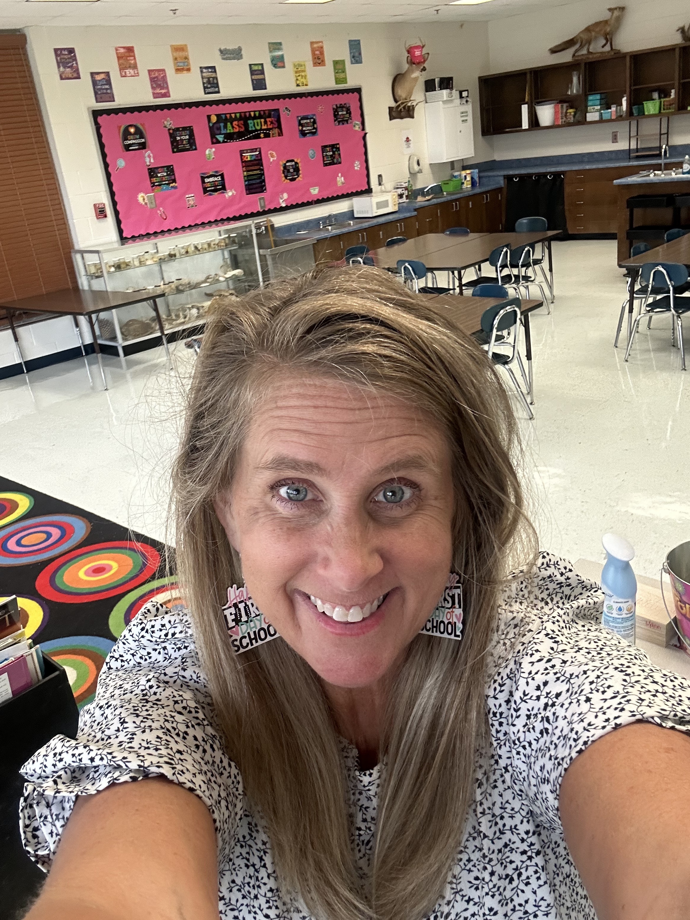 woman taking selfie in classroom