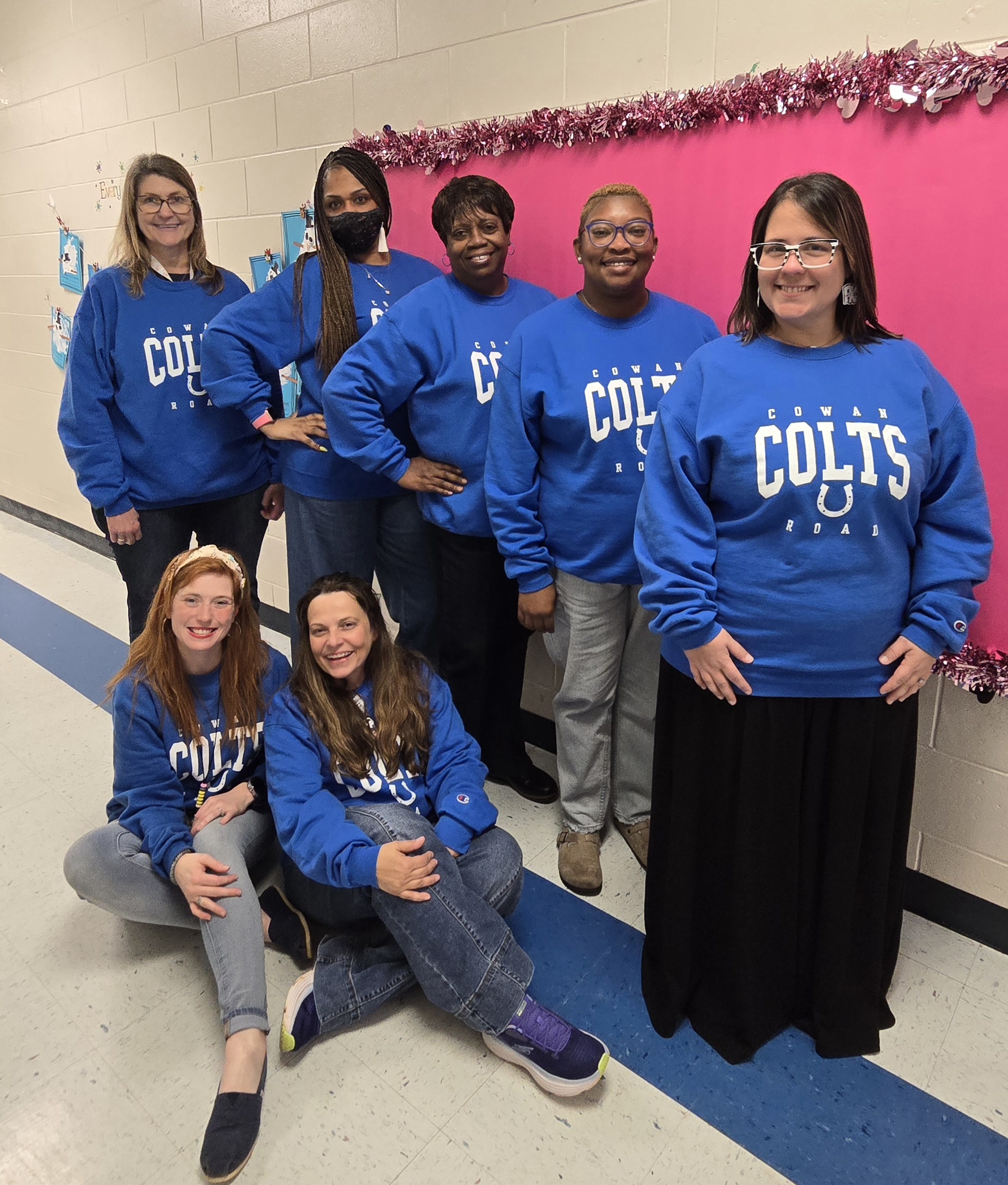 teachers in blue "Cowan Colts" tops